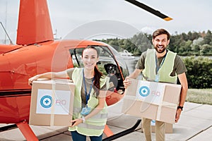 Happy two volunteers freighting helicopter