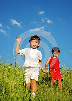 Happy unforgetable childhood on green meadow