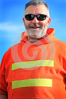 Happy Unshaven Laborer Wearing Sunglasses photo