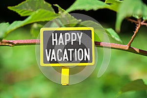 Happy vacation text on board