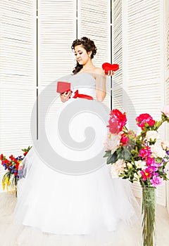 Happy Valentine's Day. Bride with red heart. Wedding and Valentine concept.