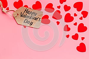 Happy Valentine`s Day design. Red hearts frame with lable on pink background top-down copy space