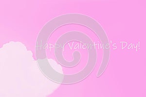 Happy Valentine`s Day, greeting card. Pink background. White cloud in shape of a heart on pink background