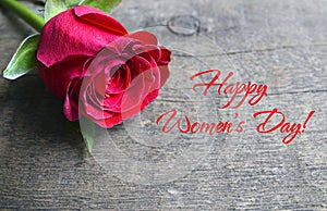 Happy Valentine`s Day greeting card.Red rose on old wooden background.St. Valentine, Love or romantic concept.