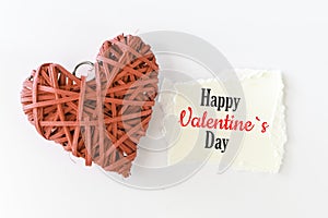 Happy Valentine`s Day message. Text on a small piece of paper `Happy Valentine`s Day`