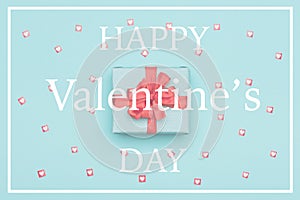 Happy Valentine`s Day Pastel Blue Candy Colour Background. Valentines day flat lay concept with beautifully wrapped present
