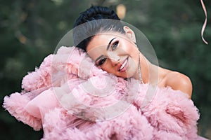 Happy Valentine`s day, portrait of fashion woman dressed in pink stunning dress