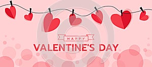 Happy valentine`s day - red paper heart shape was clipped onto a string with on soft pink circles bokeh texture background vector