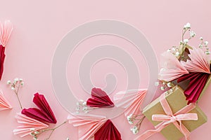 Happy Valentine\'s day ! Stylish pink and red hearts, flowers and gift box flat lay on pink background, space for text.