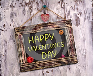 Happy valentine`s day written on Vintage sign board