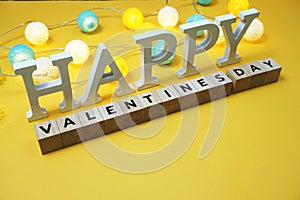 Happy Valentines Day alphabet letter with LED cotton balls on yellow background