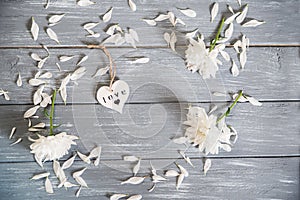 Happy Valentines Day background. Decorative white wooden heart on grey rustic. Valentine`s concept.