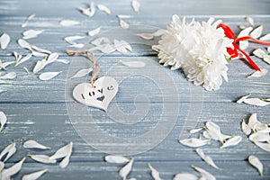 Happy Valentines Day background. Decorative white wooden heart on grey rustic. Valentine`s concept.