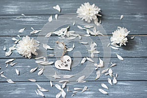 Happy Valentines Day background. Decorative white wooden heart on grey rustic. Valentine`s concept.