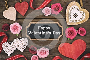 Happy Valentines Day chalkboard tag with frame of hearts and flowers photo