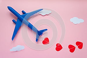 Happy Valentines day. Children`s plane on a pink background with red heart