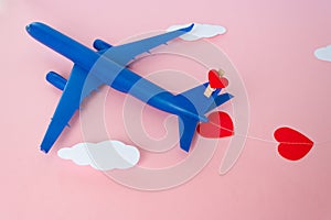 Happy Valentines day. Children`s plane on a pink background with red heart