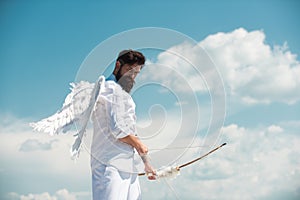 Happy Valentines Day. Crazy bearded angel man aiming with the arrow. Humor comical concept.