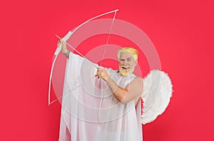 Happy Valentines Day. Cupid angel with bow and arrows. Smiling bearded man in white angel wings shooting love arrow
