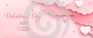 Happy valentines day greeting background in papercut realistic style. Paper clouds, heart on string, pearls. Pink banner