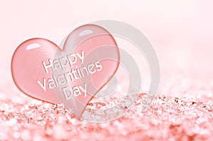 Happy Valentines day greeting card, close up on a pink ice heart