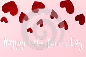 Happy Valentines Day greeting card. Happy Valentine`s Day text on stylish red hearts on pink background. Be my Valentine. Love