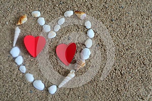 Heart made with shells on the beach.