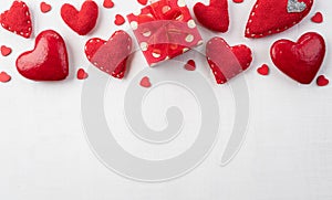 Happy Valentines day and love decoration concept. handmade red hearts with red gift box on white wooden background