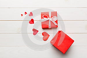 Happy valentines day opened heart shape gift box with small hearts, on colored background, valentines day card - top