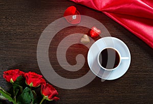 Happy Valentines Day romantic background with wedding ring, rose flowers, cup of coffee