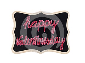 Happy valentinesday, written on a black chalkboard with wooden frame