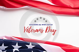 Happy Veterans Day. American flags with the text thank you veterans against a white background. November 11