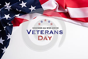 Happy Veterans Day. American flags with the text thank you veterans against a white background. November 11