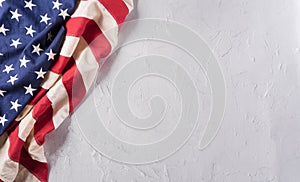 Happy Veterans Day concept. American flags against a white stone  background. November 11