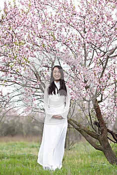 Happy Vietnamese girl in White Ao Dai