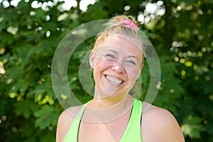 Happy vivacious woman with a beaming friendly smile