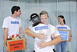 Happy volunteer group with food donation