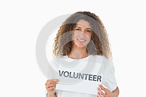 Happy volunteer showing a poster