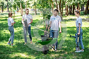 happy volunteers planting trees