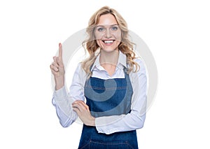 happy waiter woman in apron point finger isolated on white background