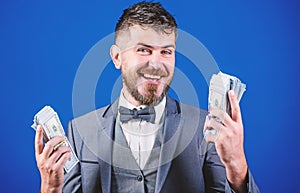 Happy and wealthy. Rich businessman with us dollars banknotes. Bearded man holding cash money. Currency broker with