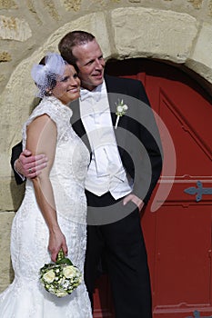Happy wedding couple looking to the side