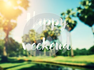 Happy weekend text with blur coconut trees and color sky. photo