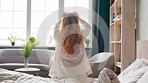 Happy wellbeing Caucasian woman healthy girl waking up in tranquil morning in cozy bed soft orthopedic mattress awake
