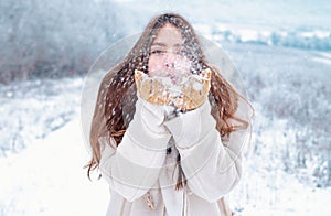 Happy winter child. Cute boy in winter. Winter holidays concept. Snowfall.