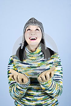 Happy winter girl looking up