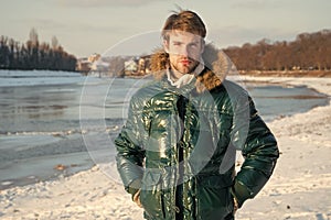 Happy winter holidays. Flu and cold. Warm clothes for cold season. Man traveling in winter, nature. Winter fashion