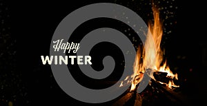 Happy Winter theme with wood fire on black banner