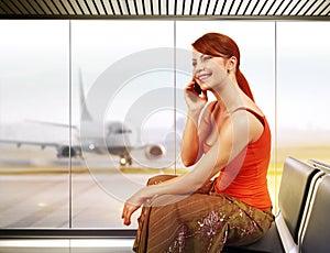 Happy woman in airport