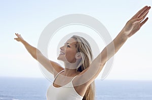 Happy Woman With Arms Outstretched photo